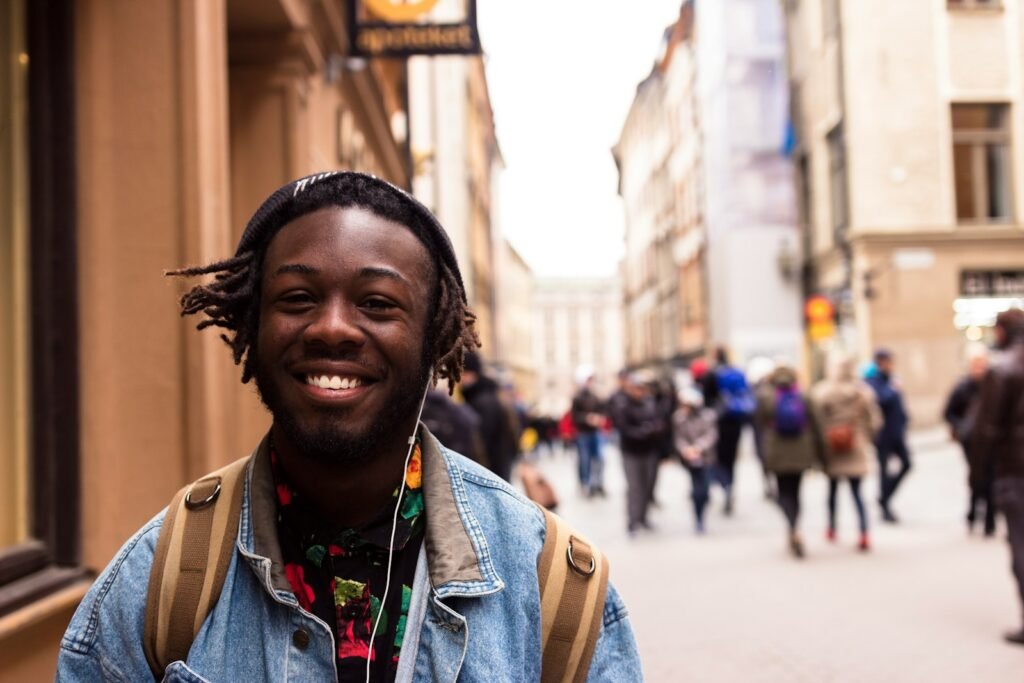 selective focus of man smiling near building